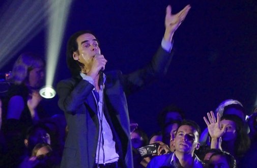 Nick Cave performing on stage